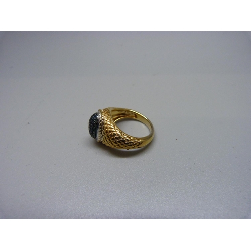 1064 - A silver gilt ring, pave set with blue diamonds, L