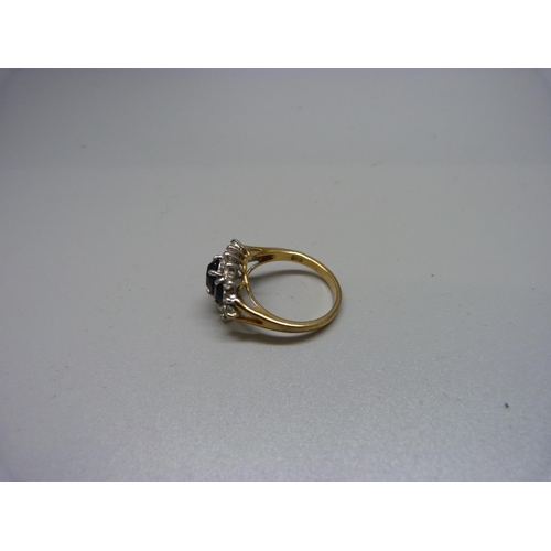 1069 - A silver gilt, blue and white stone ring, R