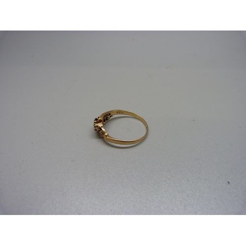 1072 - An 18ct gold, red stone and diamond ring, 2.7g, R