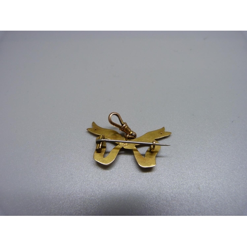 1086 - A 9ct gold hanging bow brooch, 2.6g