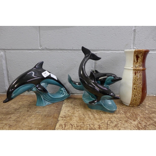 1158 - A Poole vase and two dolphin figures