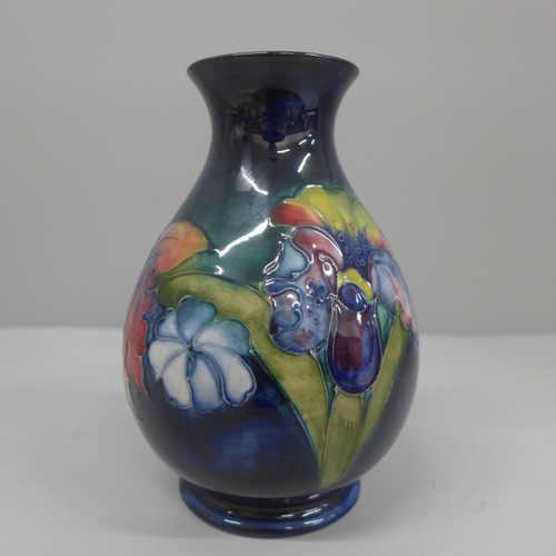 606 - A Moorcroft Orchid pattern vase, 15.5cm