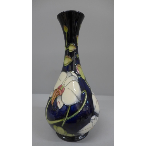 608 - A Moorcroft Chatsworth Orchid pattern vase, designed by Philip Gibson, 125/350, 23.5cm