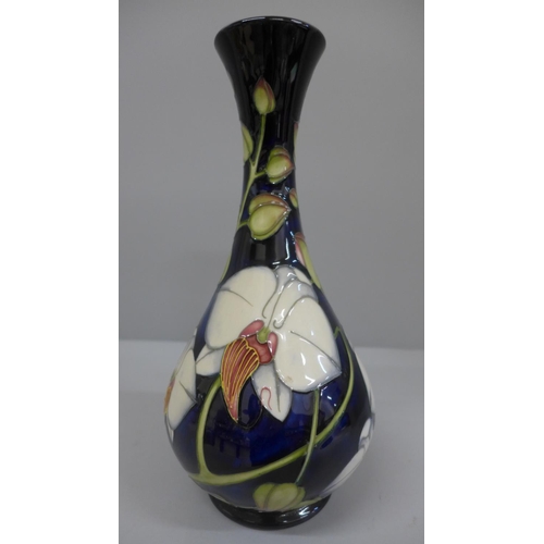 608 - A Moorcroft Chatsworth Orchid pattern vase, designed by Philip Gibson, 125/350, 23.5cm