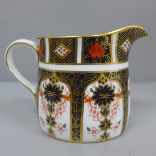 623 - A Royal Crown Derby 1128 pattern milk jug, 10cm, second