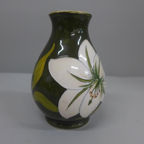 630 - A Moorcroft Bermuda Lily vase, 13.5cm