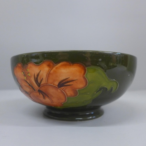 631 - A Moorcroft Hibiscus pattern bowl, 16cm diameter