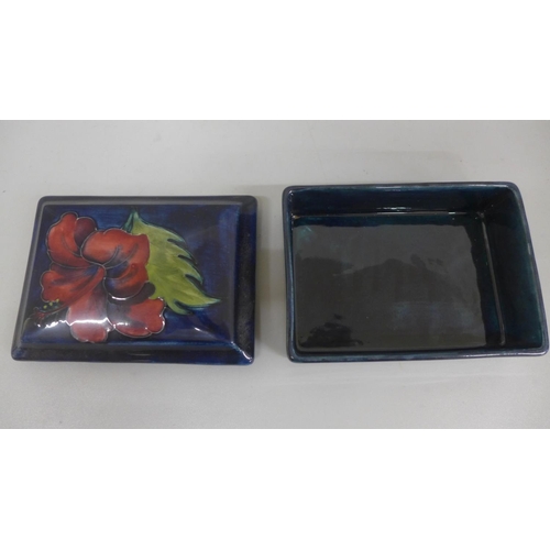 635 - A Moorcroft Hibiscus pattern rectangular box, 11.5 x 8.25cm