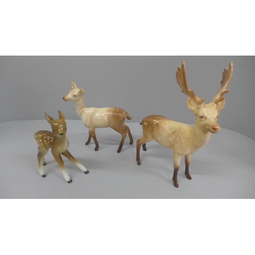 647 - A Beswick stag and doe and a model of a foal