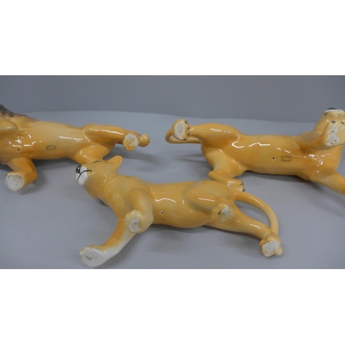 648 - A Beswick lion, lioness and cub