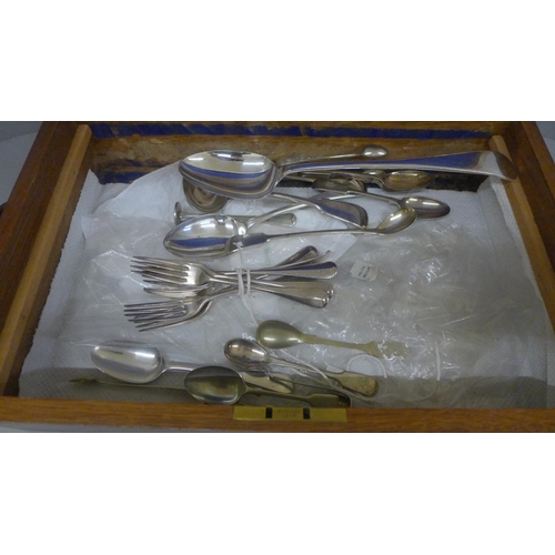 649 - A collection of plated flatware in an oak cutlery case with presentation brass cartouche dated 1916