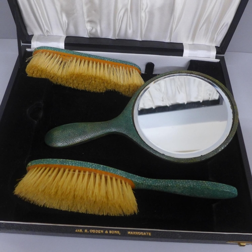 650 - A shagreen covered vanity set in fitted case