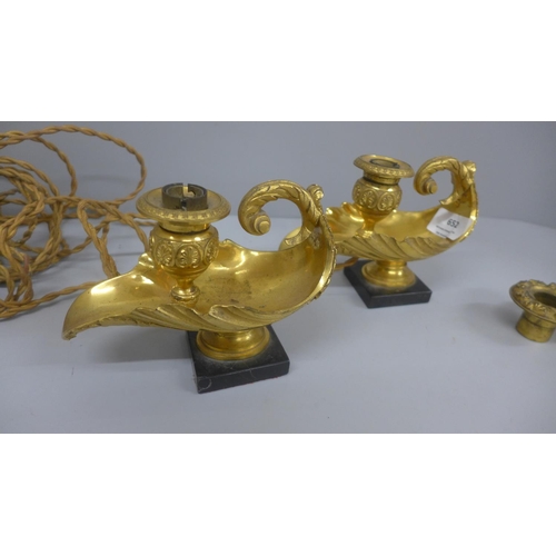 652 - A pair of gilt bronze ormolu chambersticks, converted to lamps