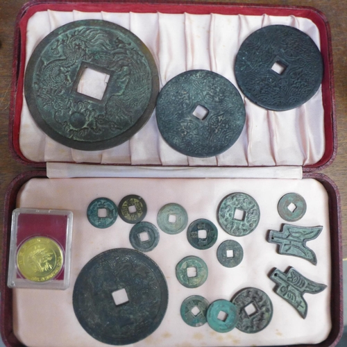 653 - A collection of Japanese and Chinese bronze currency including spade coins, nineteen in total