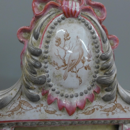 654 - A late 19th/early 20th Century porcelain table mirror with hand painted scenes of a landscape, bird ... 