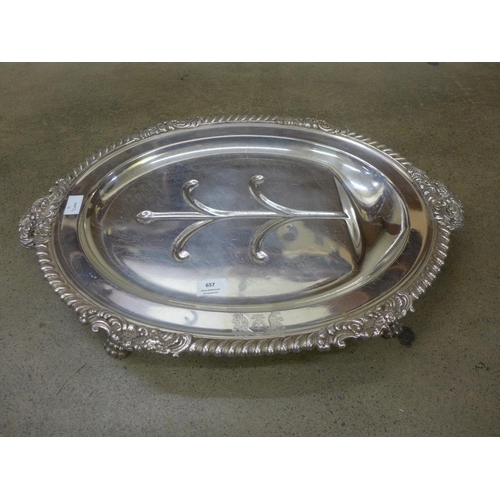 657 - A large silver-plated meat serving/warming plate, 66cm