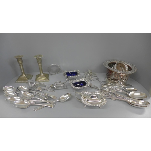 658 - A box of mixed silver plate including wine coasters, candlesticks, etc.