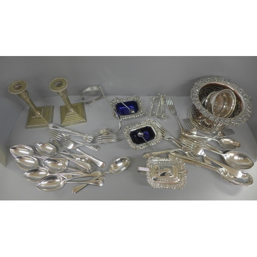 658 - A box of mixed silver plate including wine coasters, candlesticks, etc.