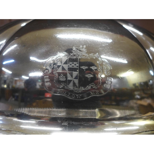 659 - A silver plated meat dome with armorial crest, an associated large tray and spoon