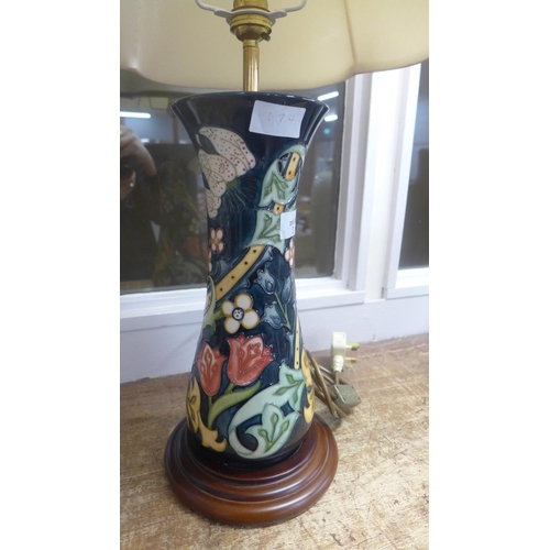 674 - A Moorcroft table lamp in Golden Lily pattern by Sally Tuffin, 30cm