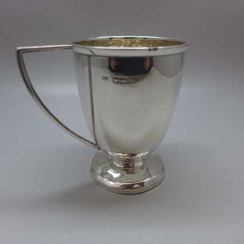 712 - A silver mug, Walker & Hall, with monogram dated 1953, 60g