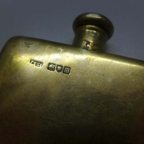 723 - A small silver gilt hip flask, London 1907, Charles & George Asprey, 56g, 69mm wide