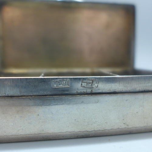 724 - A white metal box, with control marks, 74mm wide