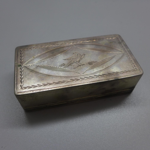 724 - A white metal box, with control marks, 74mm wide