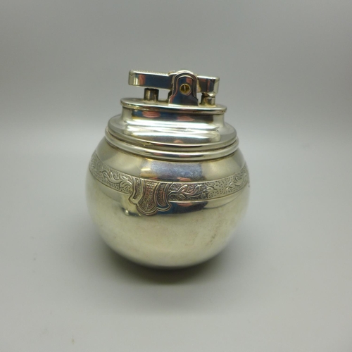 736 - A globular silver table lighter, London 1956, maker RC, William Comyns & Sons