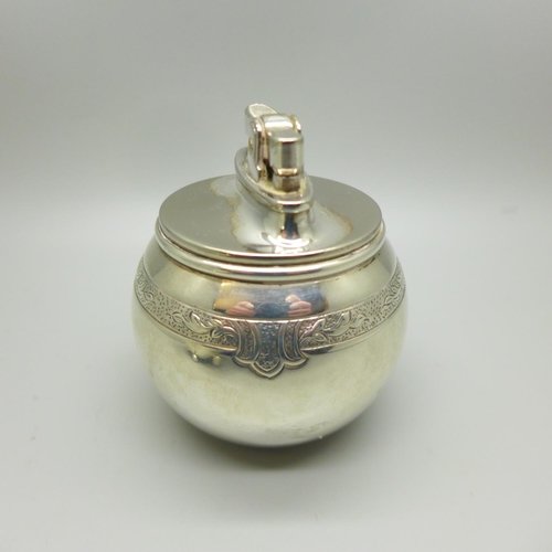 736 - A globular silver table lighter, London 1956, maker RC, William Comyns & Sons