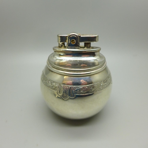 736 - A globular silver table lighter, London 1956, maker RC, William Comyns & Sons