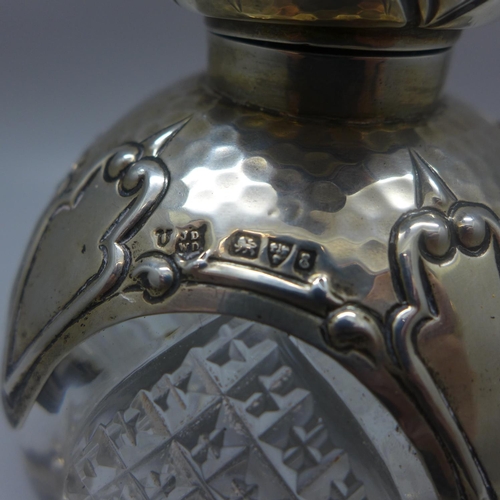 738 - An Arts and Crafts silver mounted glass perfume bottle, Chester 1905, 11cm