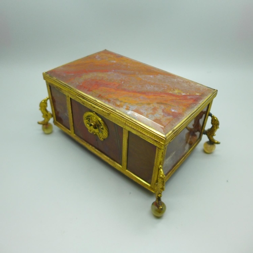 755 - A 19th Century gilt metal mounted agate panel box on globular agate feet, width of top 132mm