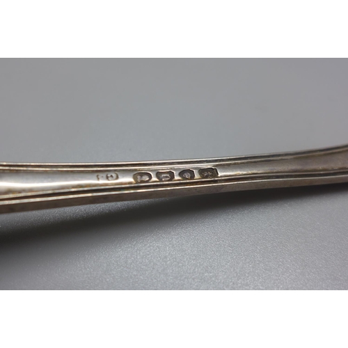 758 - A large George IV silver serving spoon with scroll back decoration, London 1828, maker CB, 169g