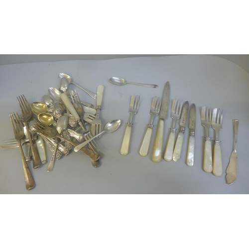 795 - A collection of silver forks, spoons and knives, some with mother of pearl handles, total weight 908... 