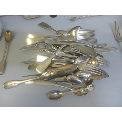 798 - A collection of silver and white metal flatware, etc., 1,145g of hallmarked silver