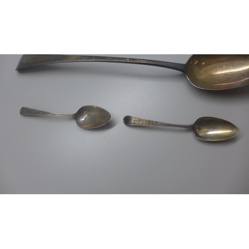 799 - A George III silver serving spoon, London 1798, and two other silver spoons, 120g