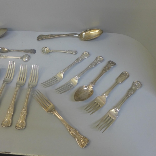 811 - A collection of silver and white metal King's pattern flatware, 1,167g of hallmarked silver, (four w... 