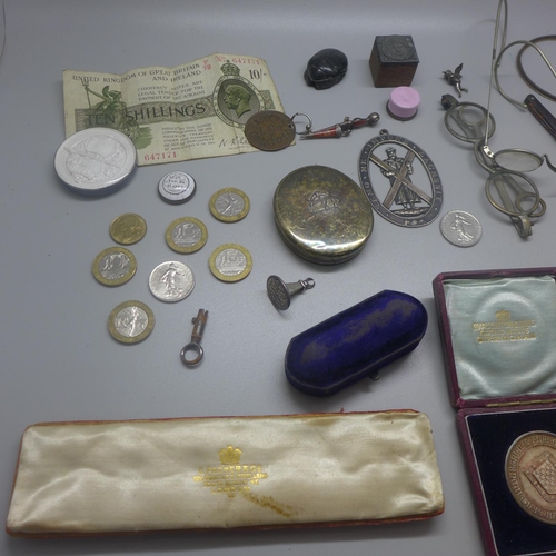 822 - Assorted items including a pill box, spectacles, a silver medallion, one other medallion, a silver l... 