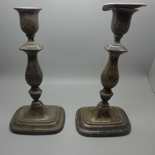 843 - A pair of silver candlesticks, a/f, 22cm