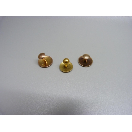 895 - Two 9ct gold studs, 3.9g, and a 15ct gold stud, 1.5g