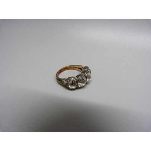 900 - A c1900 ring set with four white stones, O