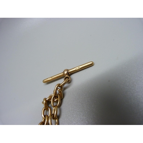 903 - A long 18ct gold Albert chain with two 9ct gold clips and a plated circular fastener, total weight 6... 