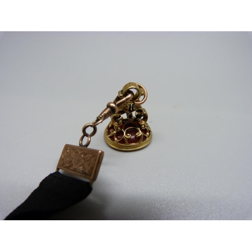 918 - A yellow metal seal fob with yellow metal mounted Albert