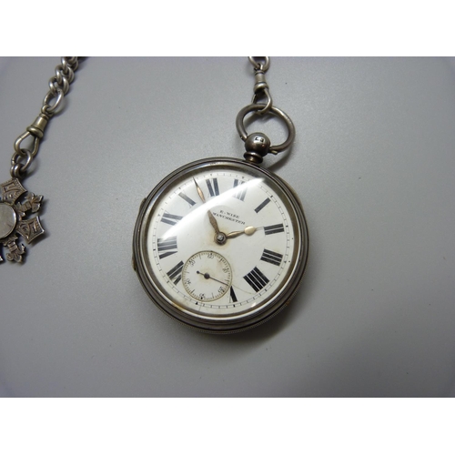 962 - A silver pocket watch on a large silver Albert chain, each graduated link marked, the dial marked E.... 