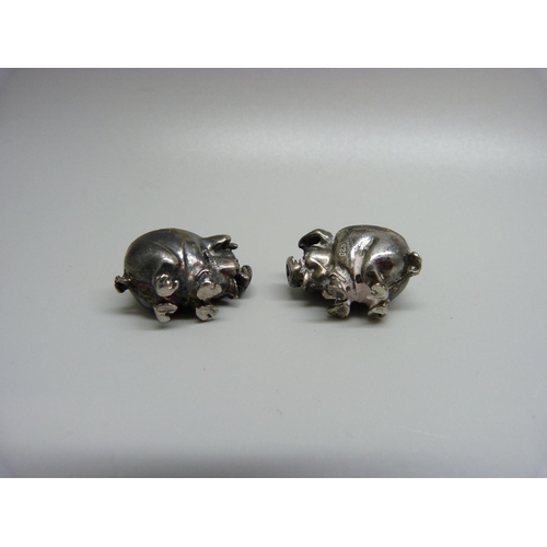 967 - Two small novelty silver pig pin cushions, one with full hallmarks, the other marked 925