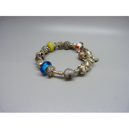 968 - A Pandora charm bracelet with silver charms