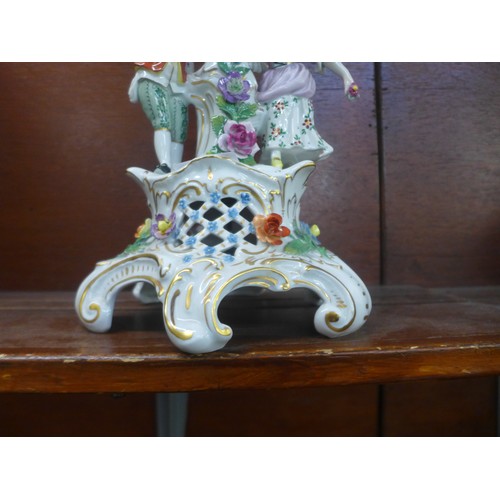 641 - A Dresden porcelain figural and floral encrusted candelabra, 48cm