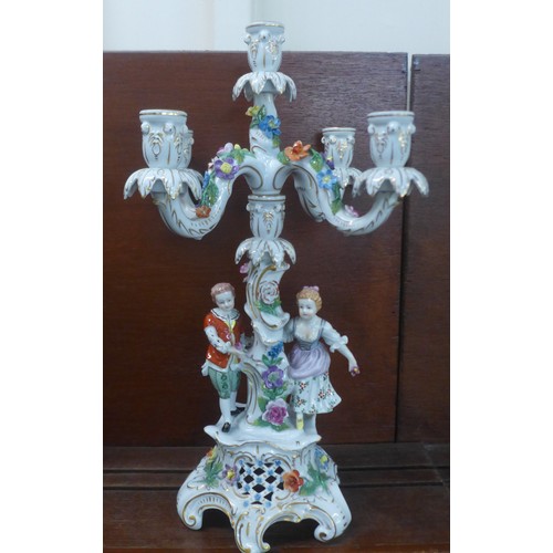 641 - A Dresden porcelain figural and floral encrusted candelabra, 48cm