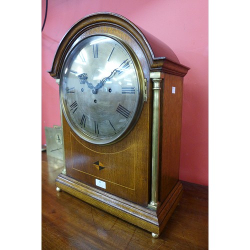 89 - A late 19th/early 20th Century inlaid oak musical boardroom clcok, with triple chain fussee movement... 